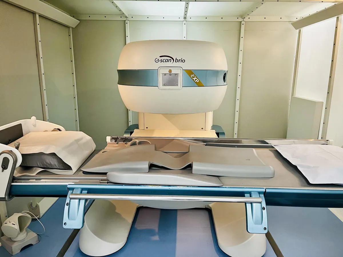 Patient being positioned in an open MRI scanner